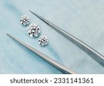 Small photo of Three Stone Set of Diamonds - Trilogy Lab-Grown Diamond Set with Tweezers in Open Blue Parcel
