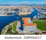 Aero Photography. View from flying drone. Old city center and port of Marseille (Vieux-Port de Marseille) with yachts and Basilique Notre-Dame de la Garde. Top View. Beautiful destinations.