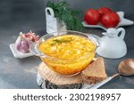 Small photo of Soup is a traditional Russian soup. Cabbage, potato and meat soup in a transparent glass tureen. Traditional Russian and Ukrainian cuisine.