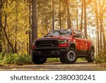 Small photo of Novosibirsk, Russia - October 06, 2023: Red Dodge Ram Trx, side view. Pick up car in a park