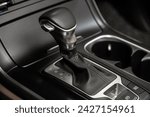 Small photo of Novosibirsk, Russia - February 13 , 2024: black Kia Carnival, Close up of the manual gearbox transmission handle. Accelerator handle and buttons in a new car.