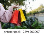 Woman holding sale shopping bags. consumerism shopper lifestyle concept in the shopping mall. shopping center with shopping bag.