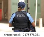 Small photo of Sydney, NSW Australia - April 25, 2020: A NSW police uniformed woman wearing a bullet proof vest