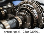 Small photo of Close-up of a disassembled engine, parts of a car automatic transmission box on a car in a garage or repair shop station for repair or maintenance. Detail, spare parts, disassembly