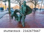Small photo of BOSTON, MA - March 10, 2022: View of the bronze statue of the famous writer and poet Edgar Allan Poe at Boylston and Charles.