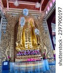 Small photo of George Town, Penang Island, Malaysia, December 24, 2022: Golden Buddha of Dhamikarama Burmese Buddhist Temple in Penang, Malaysia. Interior view of Burmese Temple Dhammikarama.
