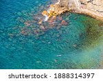 Beautiful view of of rocky mountainous coast and blue sea near Riomaggiore, Italy.