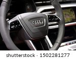 Small photo of Germany, Frankfurt - 10.September 2019: Audi S6 Limousine TDI , TDI Tiptronic - detail view of steering wheel with controls and Audi company logo - IAA Car Show Frankfurt 2019