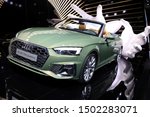 Small photo of Germany, Frankfurt - 10.September 2019: green Audi A5 TDI quattro, Tiptronic - detail view of the car body - IAA Car Show Frankfurt 2019