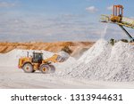 Front end loader and gypsum stock pile