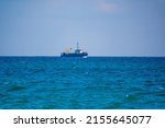 Fishing Boat In Blue Sea And...