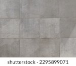 Elegant large gray square stone tiles. Background and texture.
