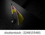 Small photo of Small national flag of the Niue on a black background.