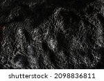 Small photo of Stone black textured background. Infernal Stone