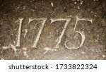 "1775" carved in stone – a detail of an inscription produced that year