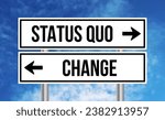 Small photo of Status quo or change road sign on sky background