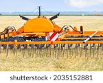 Small photo of Trailed agricultural implement for even soil distribution, cutting straw after harvest and significantly improving soil pretreatment before sowing.