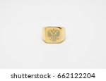 Small photo of one thick men's gold signet ring with a picture of the double-headed eagle isolated on white background