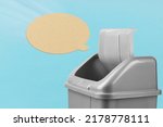 Small photo of Delete the message, refuse to speak. Throw away the speech bubble in the trash can, gray bucket on a blue background