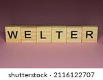 Small photo of text the word welter from gray wooden small letters on an pink table