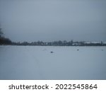 A Snow Covered Field On A...