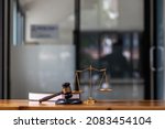 Small photo of The gavel is placed on the desk next to the law book in the office that serves as a legal advisor. good-looking image of a legal counsel's office will make those seeking legal advice more trustworthy.