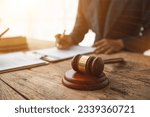 Small photo of contract of sale was placed on the table in the lawyer office because the company hired the lawyer office as a legal advisor and drafted the contract so that the client could sign the right contract.