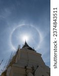 Small photo of rainbow ring phenomenon that occurs around sun is rare natural phenomenon that occurs frequently during rainy season and rainbow ring phenomenon that occurs around sun in Thailand is called Sun Halo.