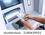 Small photo of Atm money cash machine. Woman withdraw money bill. Holding american hundred dollar cash. Bank credit card, us dollar