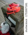 Small photo of Bellevue, Washington / USA - June 1 2020: Pair of looted shoes on a trash can, after unpeaceful Police violence protests