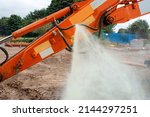 Small photo of An incident in construction as a hydraulic hose on excavator split and liquid started sprinkling around under high pressure