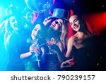 Small photo of Dance party with group people . Dancing youth under influence of drugs. Women and confident casual smiling man have fun in night club. Seduce boozy woman cuddles up guy .