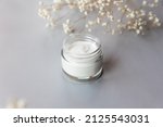 Open White Cosmetic Glass Jar....