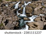 Small photo of McLaren Falls, actually multiple cascades, is located on Mangakarengorengo River, Near Tauranga. In warm days lots of people swim in cool water at the base of these waterfalls.