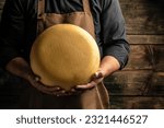 Cheesemaker hold big slice of...