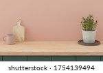 Small photo of Minimal kitchen interior mock up design for product presentation background or branding concept with green counter bright wood top and pink wall include vase with plant chopping block and glass