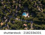 Small photo of Germantown, Maryland, USA - July 24, 2022: An aerial view of the community of Waters Landing next to Lake Churchill, a residential neighborhood in the Washington, DC suburbs. The community has a pool.