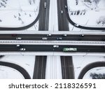 Transport junction traffic road. Aerial high above view of modern road junction. Top down aerial winter view of a road. Two-level intersection of two highways