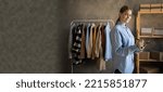 Small photo of Startup small business entrepreneur SME, young woman selling clothes online. small business owner in home office, online sell marketing delivery, SME e-commerce telemarketing concept. Banner