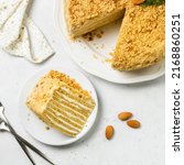 Small photo of Almond citrus homemade honey cake on plate. Top view, space for text.