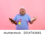 Small photo of Fat doubter man acts like a doubter baby but drinks beer