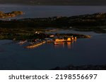 Brensholmen seen from Ornfloya Hiking Trail illuminated by the midnight sun at Sommaroy, Tromso Norway
