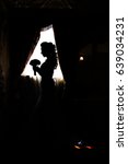 Silhouette Of A Bride Posing In ...