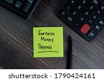 Small photo of Earnest Money Deposit write on sticky notes isolated on office desk.