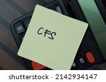 Small photo of CFS write on sticky notes isolated on Wooden Table.