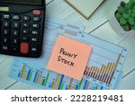 Small photo of Concept of Penny Stock write on sticky notes isolated on Wooden Table.