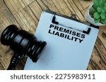 Small photo of Concept of Premises Liability write on paperwork isolated on Wooden Table.