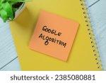 Concept of Google Algorithm write on sticky notes isolated on Wooden Table.