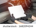 Small photo of Women driver looking air filter in cooling system of car by myself check dust and amiss in Passenger car of car service concept