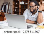 Small photo of Misunderstanding concept. African-American man staring at the laptop screen confused, received wrong emails, has issue with project, entered the wrong password and blocked the laptop